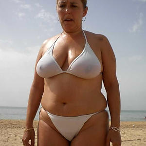 Nude women in bikinis without tops